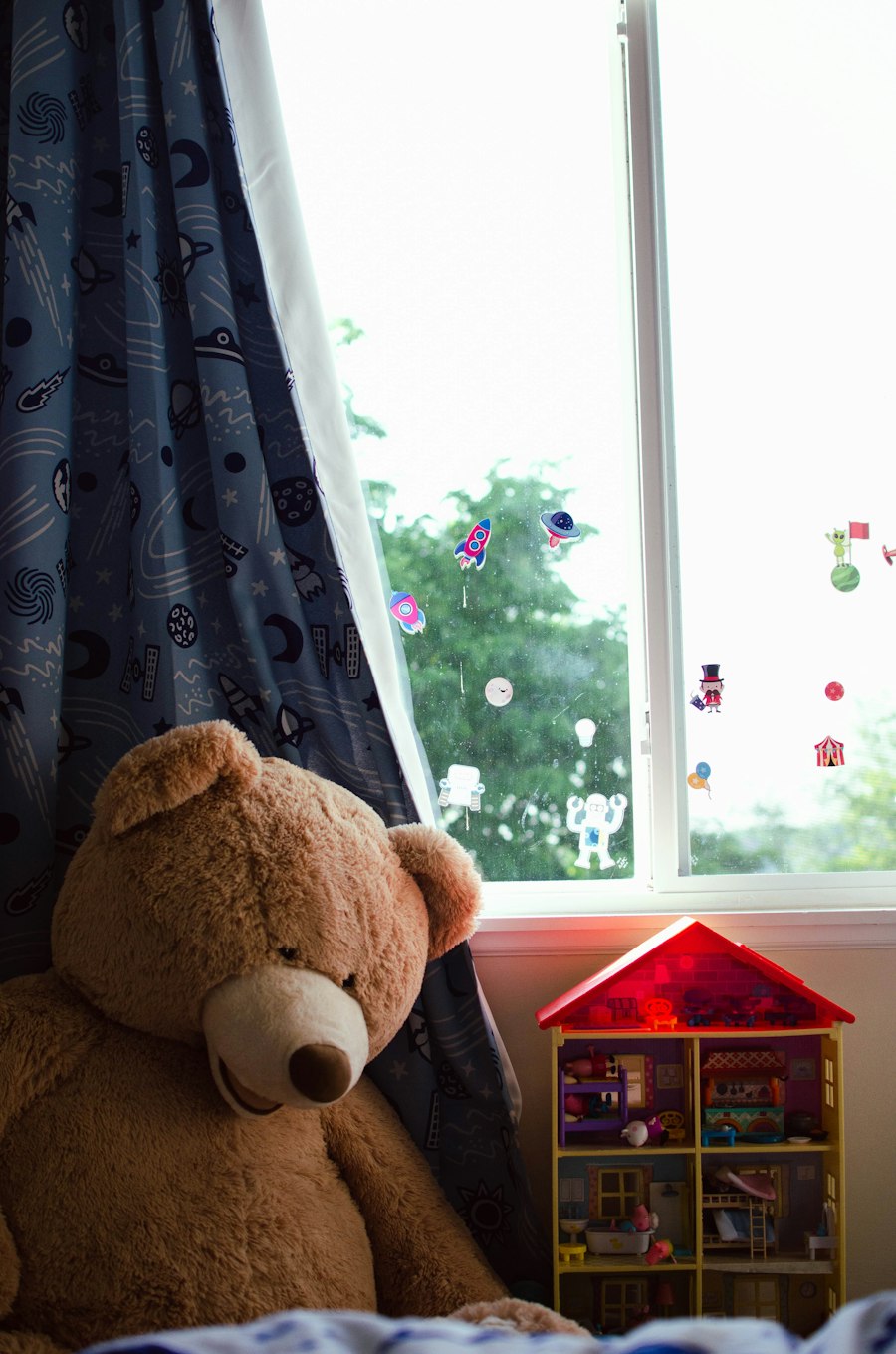 A teddy bear by a window