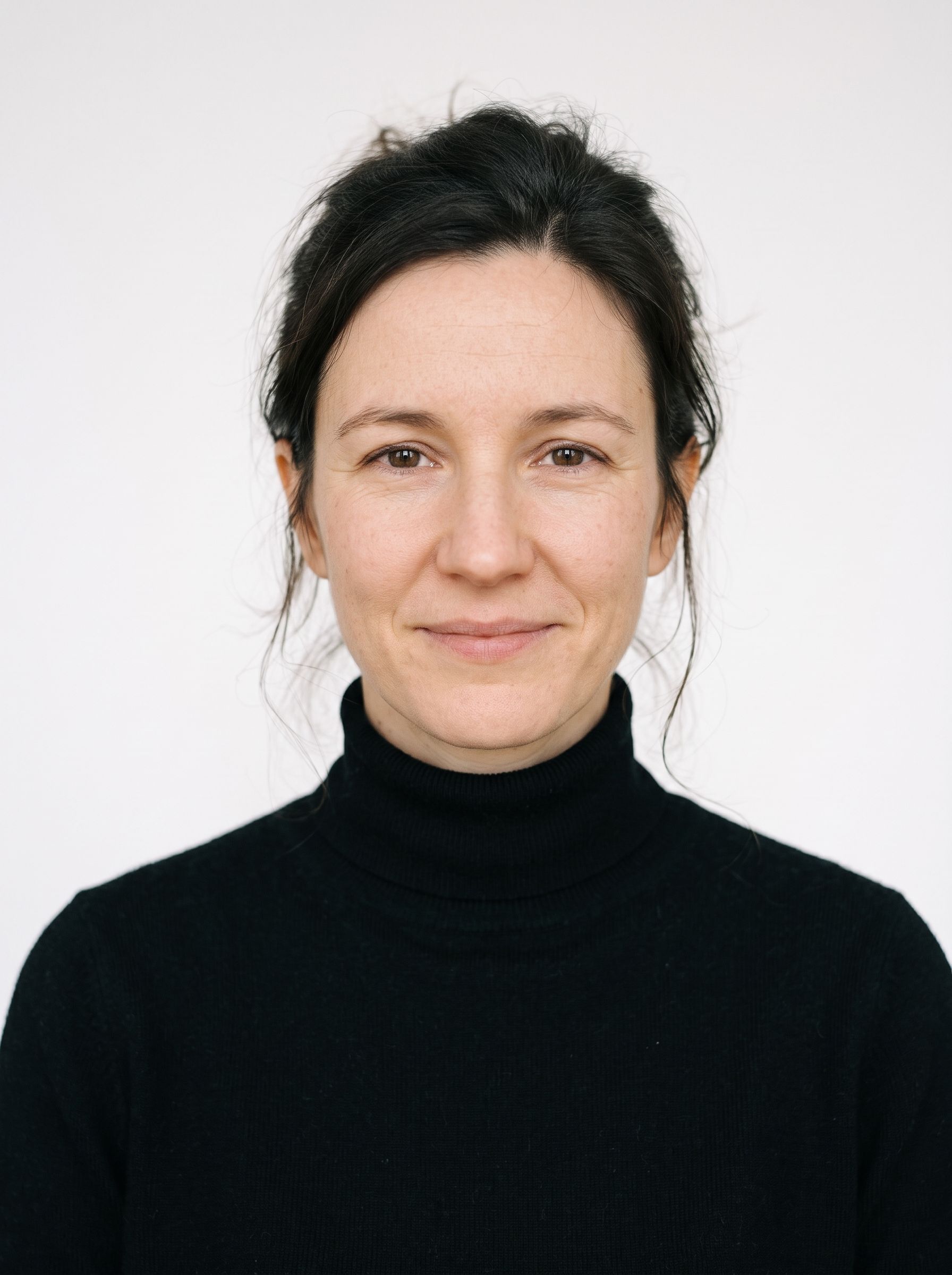Zlata Koval in a black turtleneck, smiling